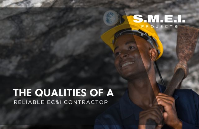 Smiling miner wearing a yellow helmet and holding a tool underground, symbolising S.M.E.I. Projects’ commitment to reliability, safety, and excellence as a trusted EC&I contractor in Africa.