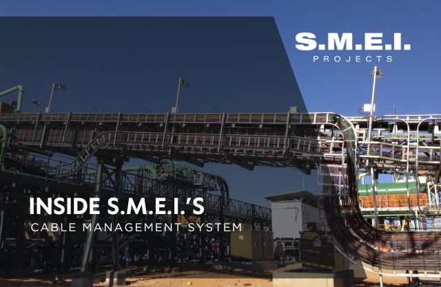 S.M.E.I. Projects’ cable management system in operation, with organised cable trays and routed electrical and instrumentation cabling across a large-scale mining installatio